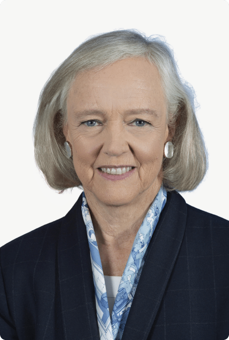 Older woman smiling in a professional headshot against a neutral background