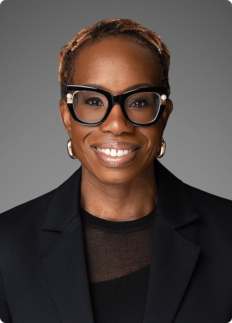 Shola Olatoye, smiling in a professional headshot