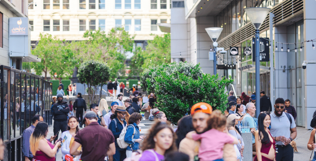 People walking, dining, and gathering along Yerba Buena Lane in downtown San Francisco